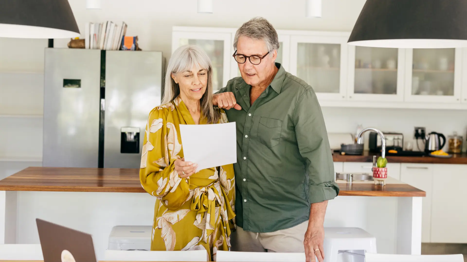 A couple reviews paperwork after they inherited a home in North Carolina