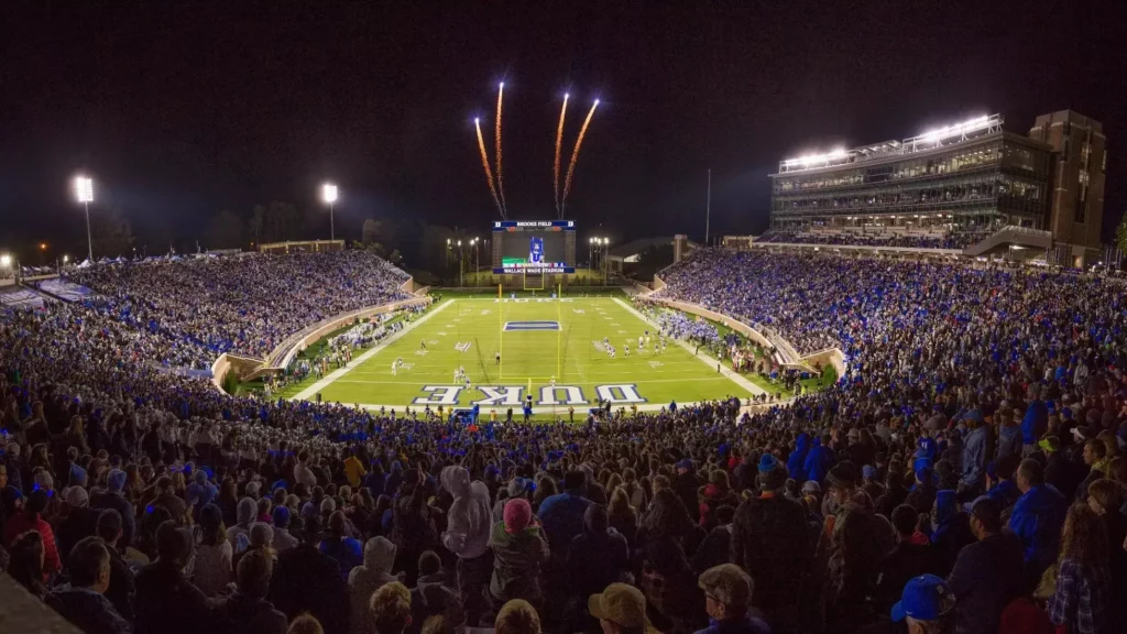 Wallace Wade Stadium in Durham is lit up with fireworks during a game. The Blue Devils are a must-watch for outstanding football in North Carolina.