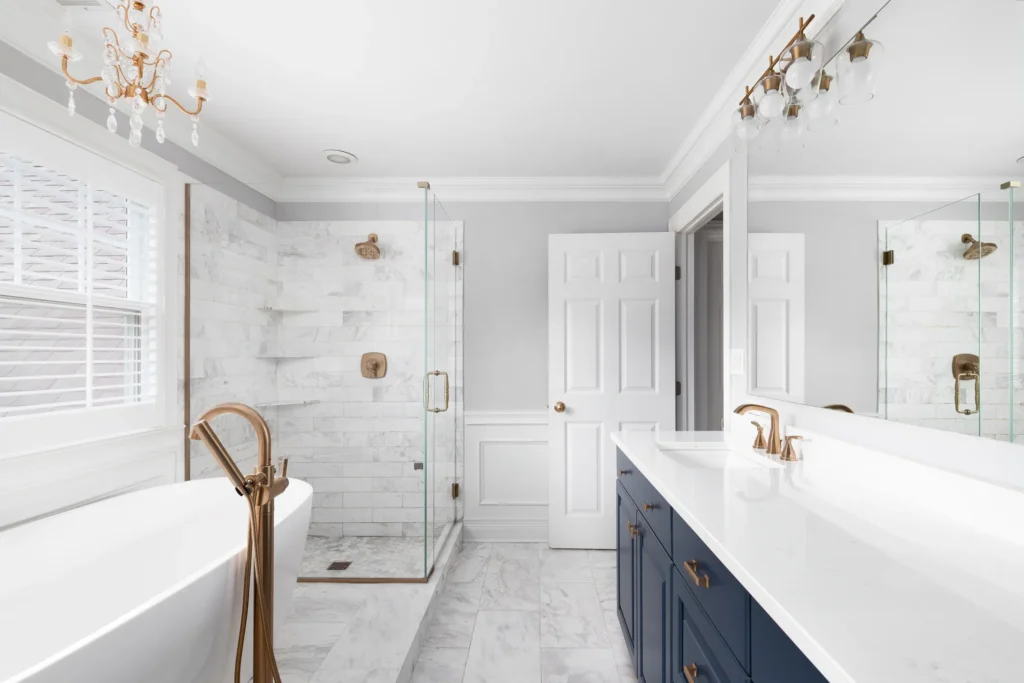 An upscale bathroom with ceramic tiling, frameless glass and freestanding tub: the cost of adding a bathroom of this type to your home in the Triangle averages around $97,073.