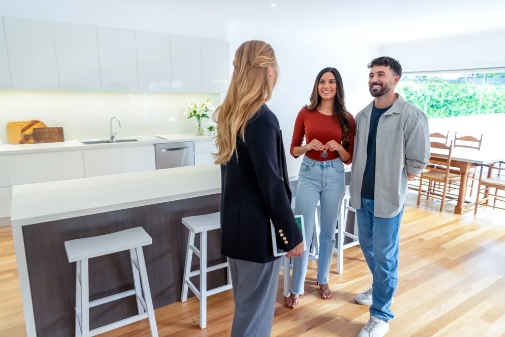 A couple tours a home with a real estate agent
