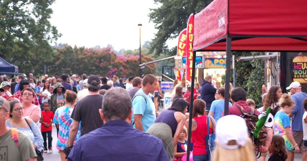Community members visit a downtown Rolesville event.