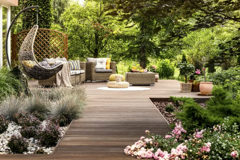 Stage a backyard living space with natural elements, greenery, and pops of color