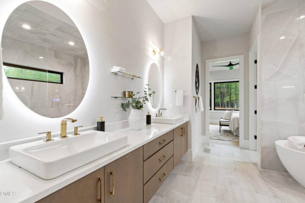 10 Gambel Drive's bathroom features Elegance Onyx tile and dual sinks with Calacutta gold quartz