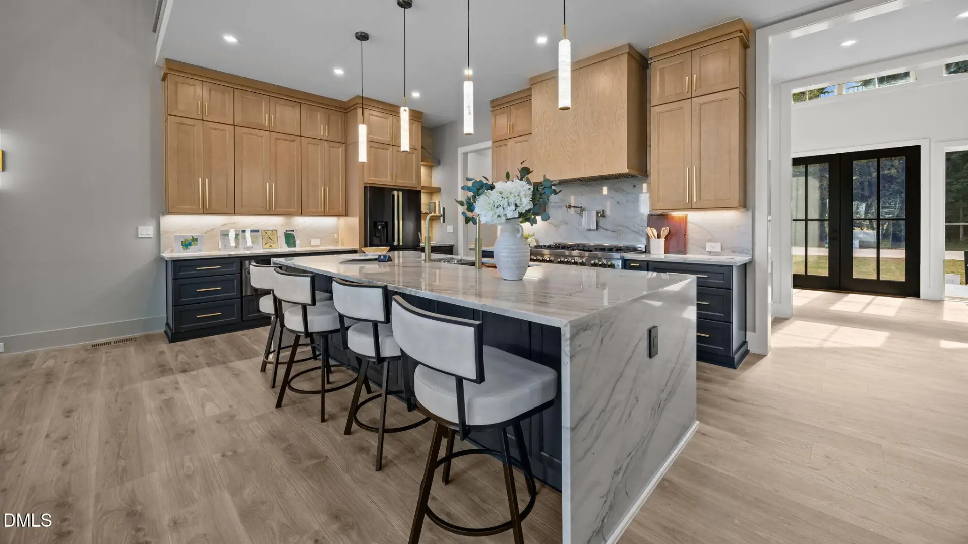 Oak & Stone Custom Homes's gold award at the Franklin County Parade of Homes for 219 Forest Bridge Road in Youngsville features a chef’s kitchen with an oversized quartz island, designer accessories, custom cabinetry, and gourmet appliances.