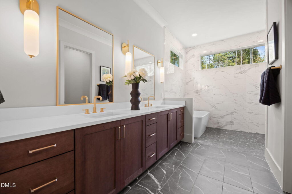 A bathroom in an owner's suite is one of the must-have new construction upgrades you should consider