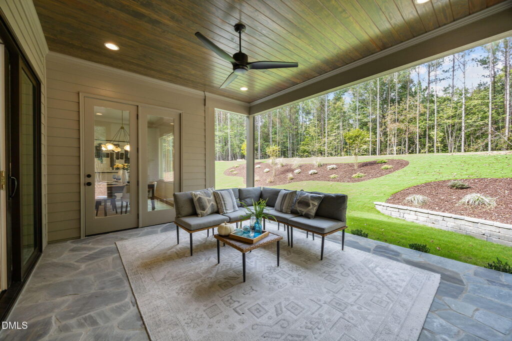 A patio with furniture and tiling is a good new construction upgrade for homebuyers